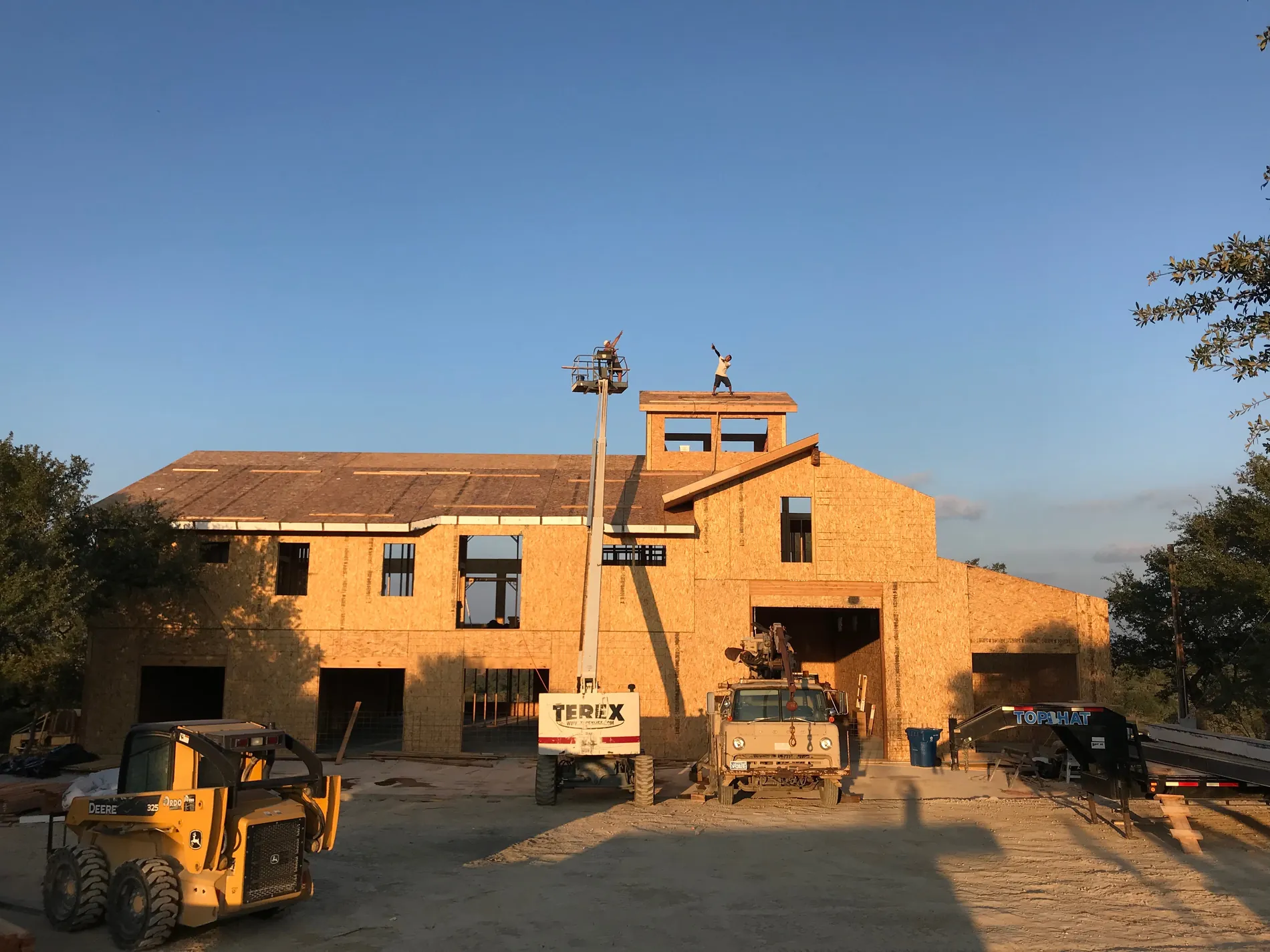 Large SIP shell under construction with garage bays and a cupola